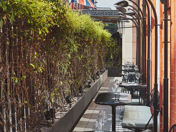 Claridge's restaurant terrace: view of alfresco tables, with wine glasses, cutlery and napkins
